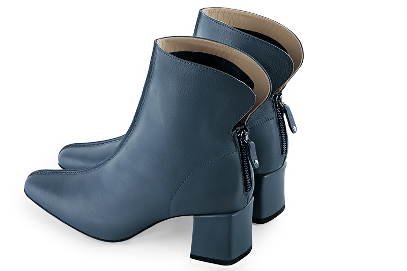 Denim blue women's ankle boots with a zip at the back. Square toe. Medium block heels. Rear view - Florence KOOIJMAN
